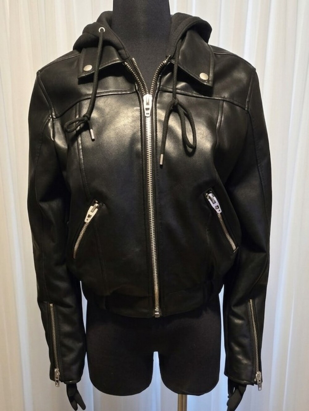 Blank NYC vegan leather cropped bomber jacket with a removable hood and Vest.